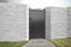 Grey aluminium pedestrian gate with solid infill,vertical slats and a flat top in-situ. image