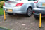 A couple of erected Folding Parking Post with Integral Lock. Locked in position image
