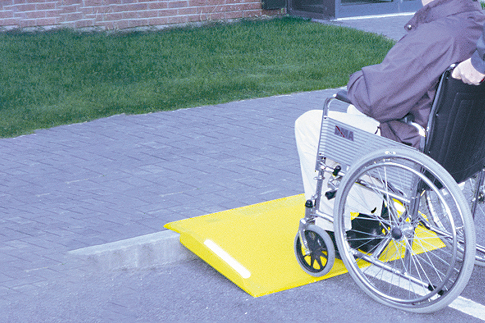 Portable ramp for moving goods or wheelchair ramp to overcome kerbs and raised surfaces
