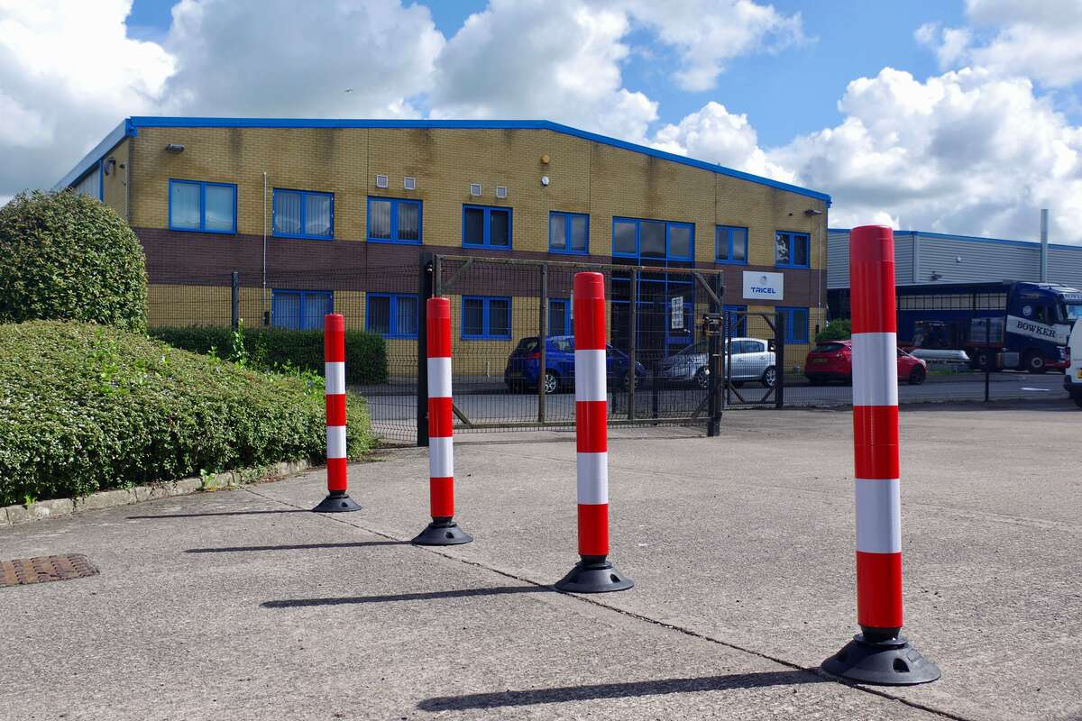 Traffic Cone Guide; Flexible Posts in Hi-Viz Red and White in a commercial car park.Â