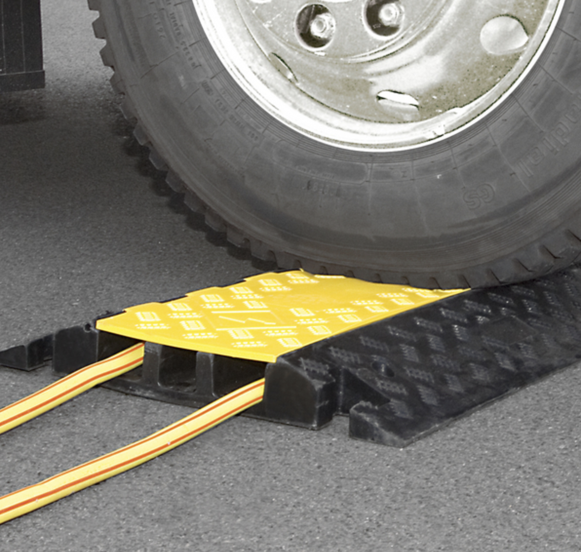 An HGV vehicle driving over a cable protection ramp