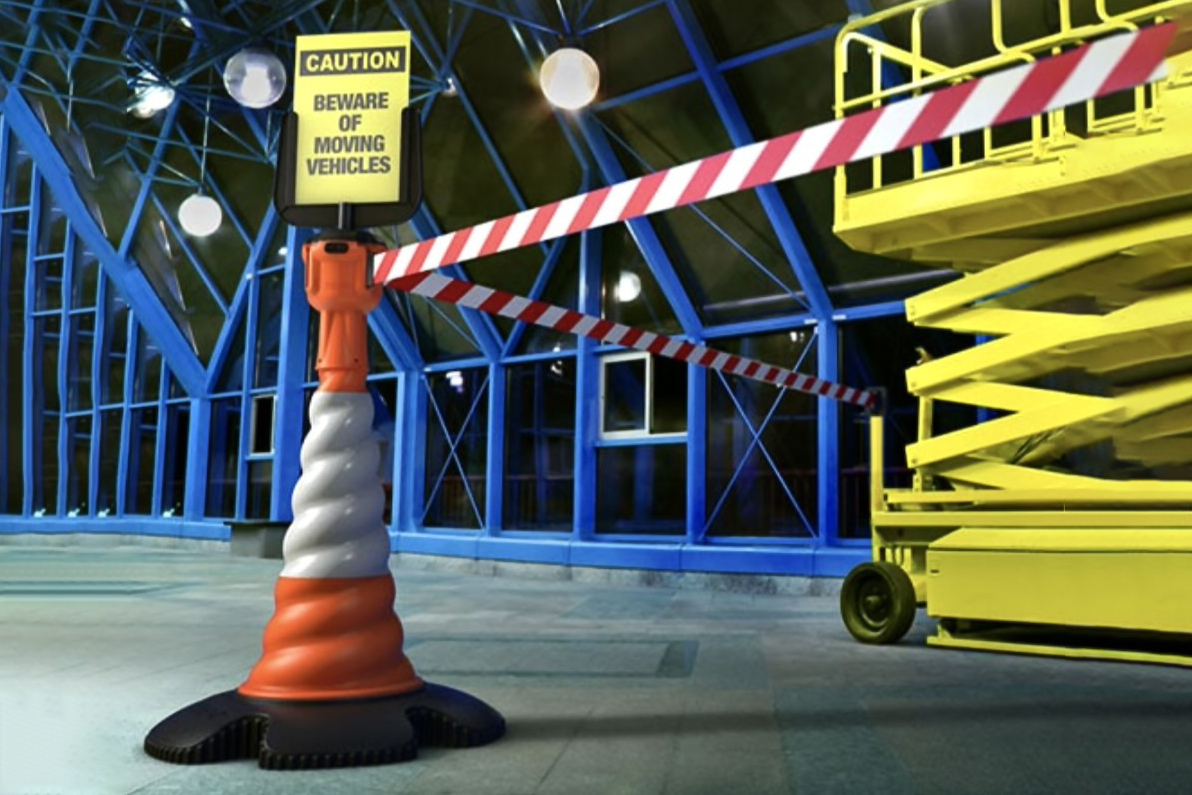 Traffic Cone Guide; a Retractable 27m Road Cone Topper Kit being used as a safety barrier in a warehouse.