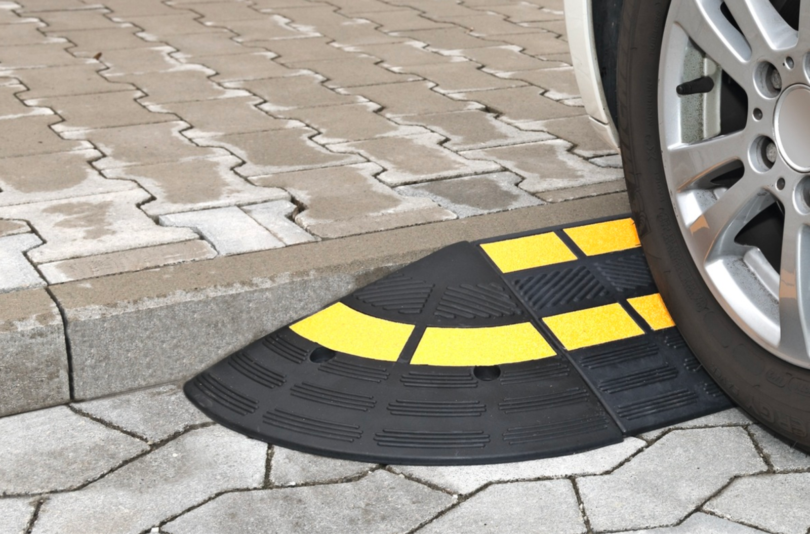 A heavy duty rubber kerb ramp
